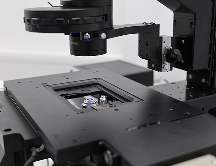 Close up of a motorized xy stage on an OpenStand-V inverted imaging platform. imaging platform